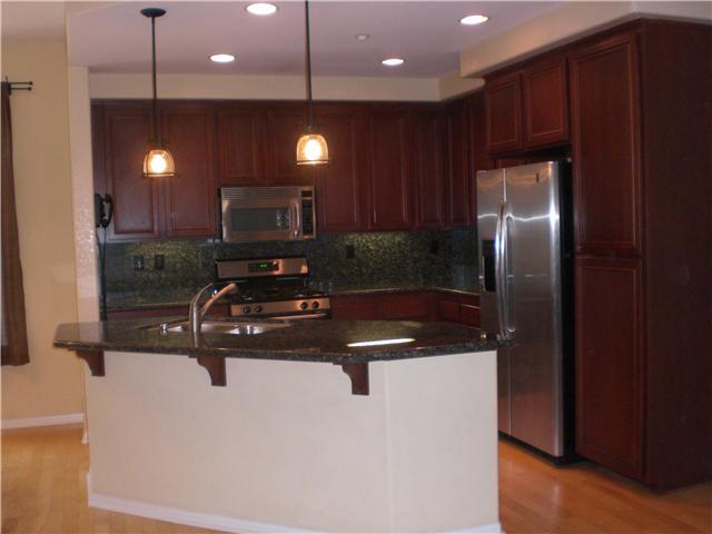 832 Almond Road San Marcos, CA 92078 - Photo 8 of 25 Kitchen with under-cabinet lighting and bar seating area