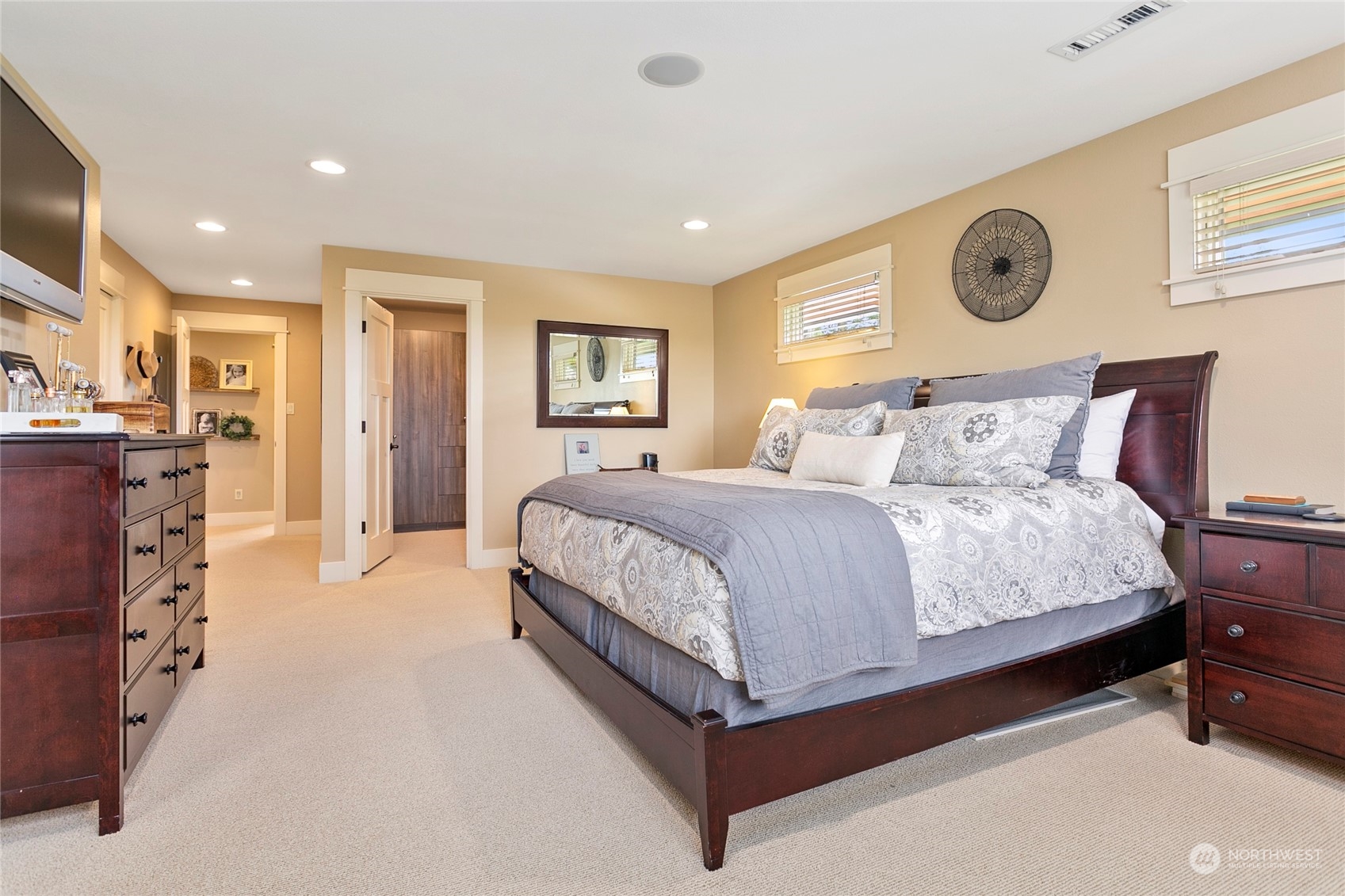 8629 Benson Road Lynden, WA 98264 - Photo 18 of 40 a spacious bedroom with a bed and a lamp on table
