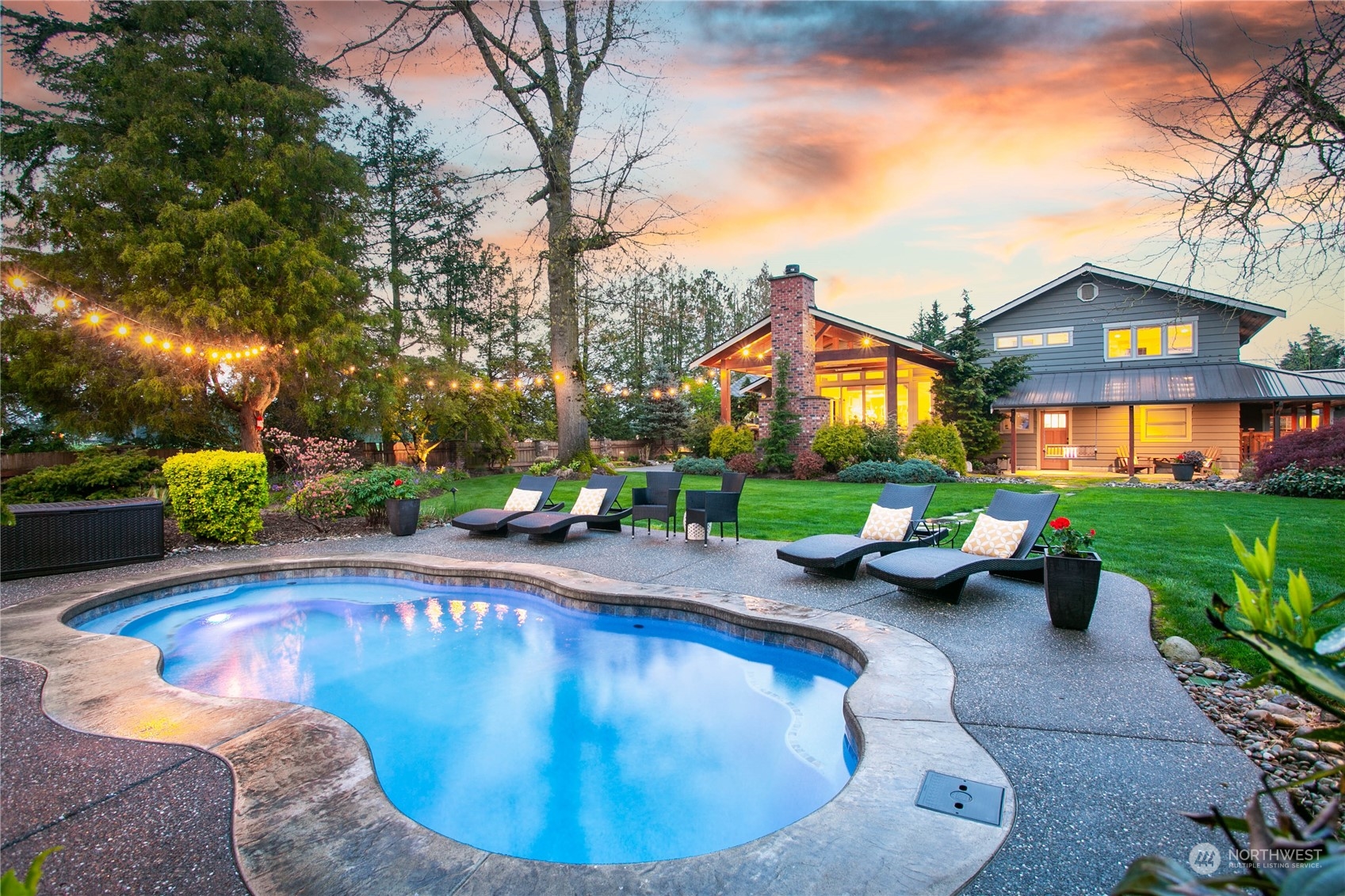8629 Benson Road Lynden, WA 98264 - Photo 2 of 40 a view of swimming pool and lounge chair