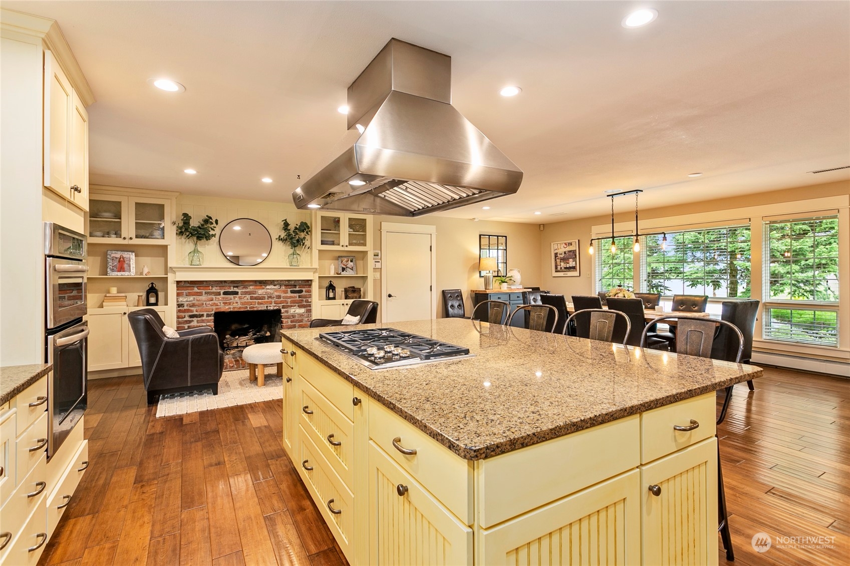 8629 Benson Road Lynden, WA 98264 - Photo 7 of 40 a kitchen with stainless steel appliances granite countertop a stove and a wooden floors