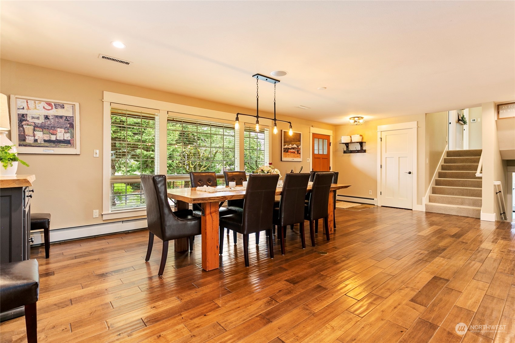 8629 Benson Road Lynden, WA 98264 - Photo 9 of 40 a view of a dining room with furniture window and wooden floor