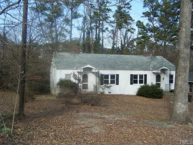 3030 Farrior Road Raleigh, NC 27607 - Photo 2 of 7 a view of a yard in front of a house with large trees
