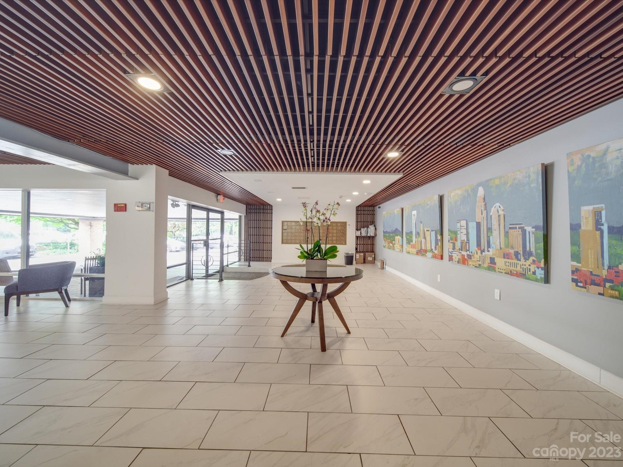1323 Queens Road, Unit 402 Charlotte, NC 28207 - Photo 20 of 26 a lobby with furniture and window