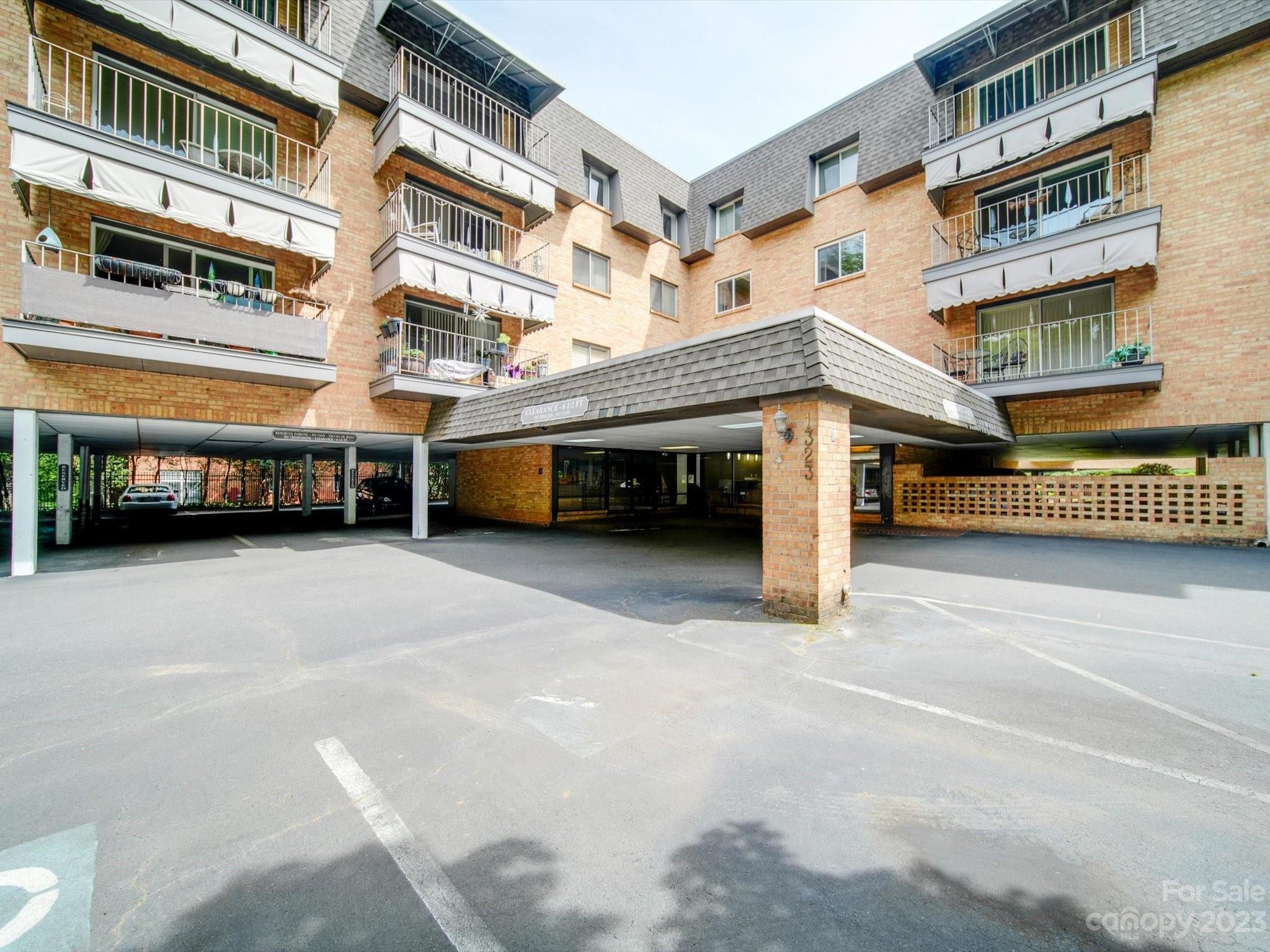 1323 Queens Road, Unit 402 Charlotte, NC 28207 - Photo 25 of 26 a view of a building with a parking space