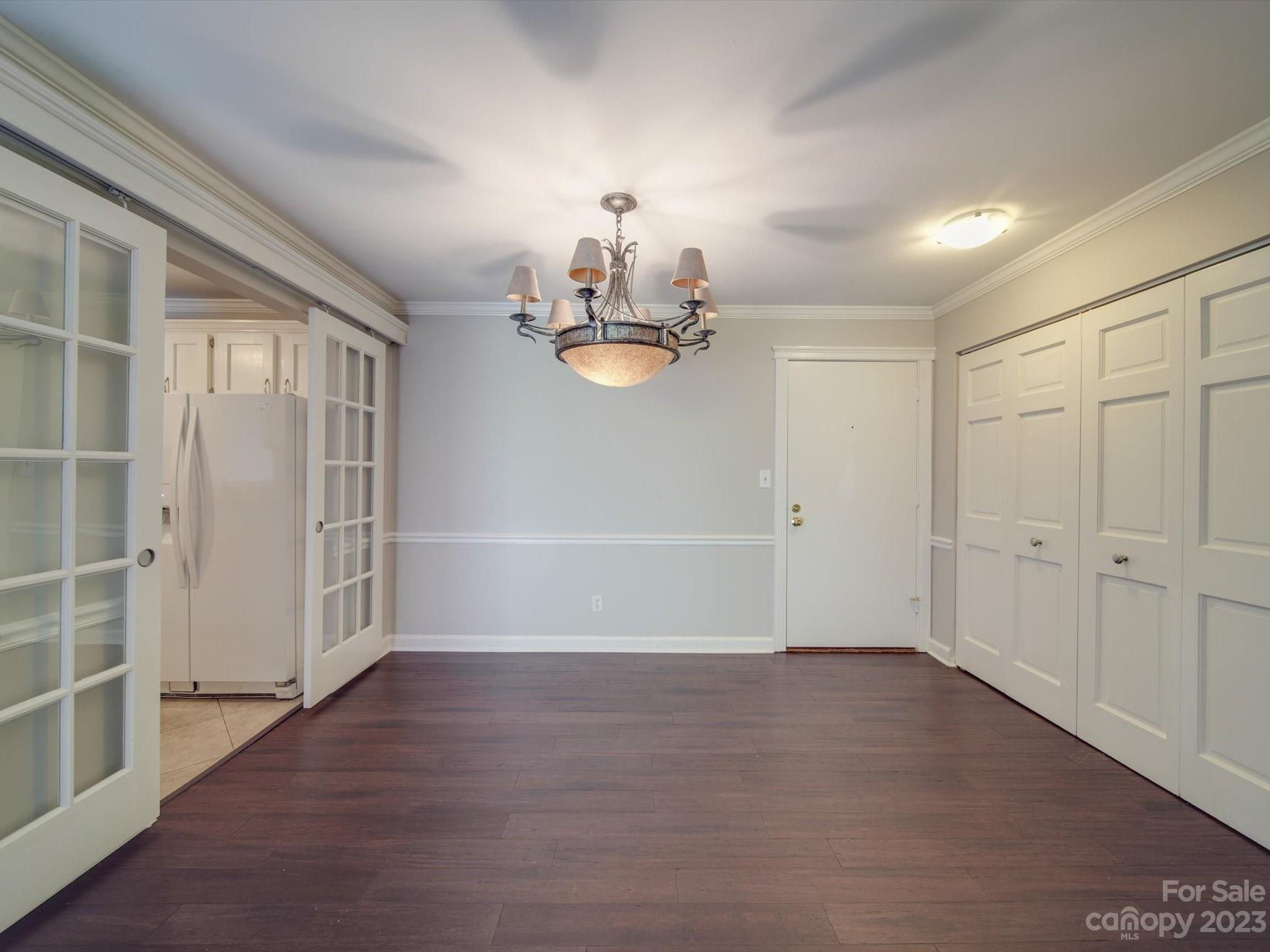 1323 Queens Road, Unit 402 Charlotte, NC 28207 - Photo 10 of 26 wooden floor in an empty room with a window