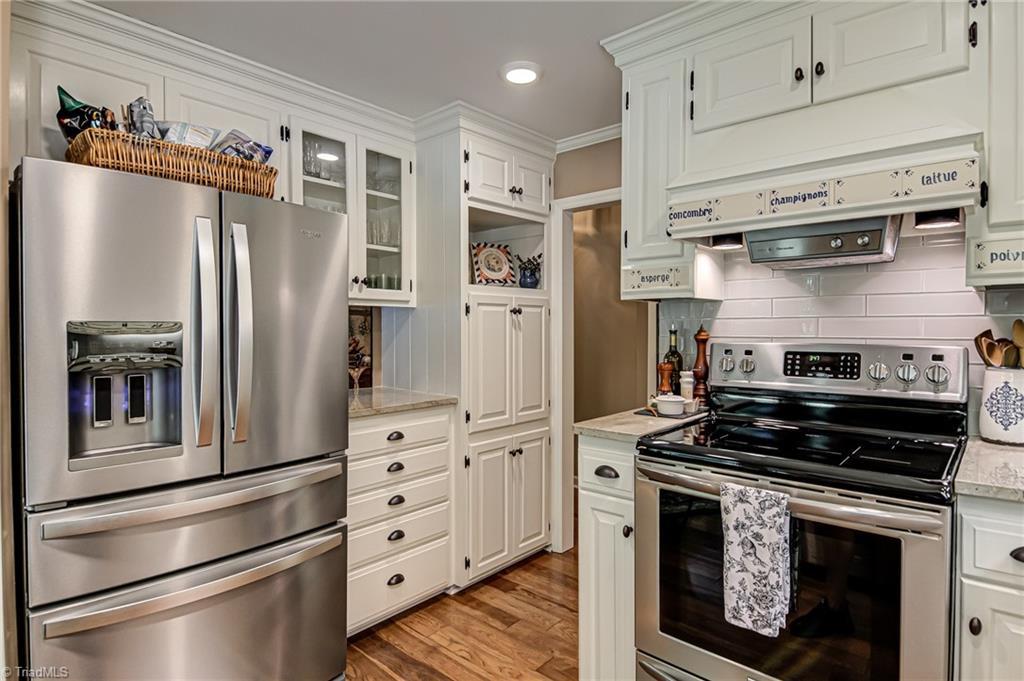 8065 Lasater Road Clemmons, NC 27012 - Photo 6 of 39 Renovated kitchen with granite counters and stainless appliances