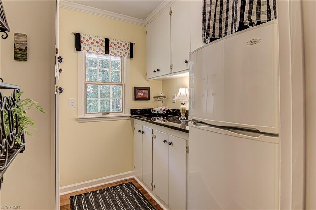 8065 Lasater Road Clemmons, NC 27012 - Photo 10 of 39 Pantry with an additional small refrigerator just off the kitchen