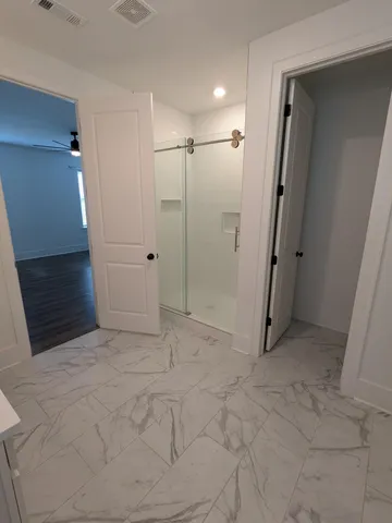 a spacious bathroom with a double vanity sink mirror and