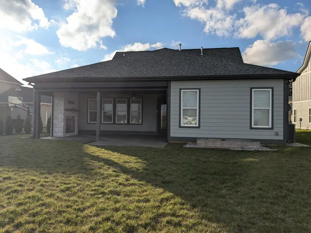 a front view of a house with a yard