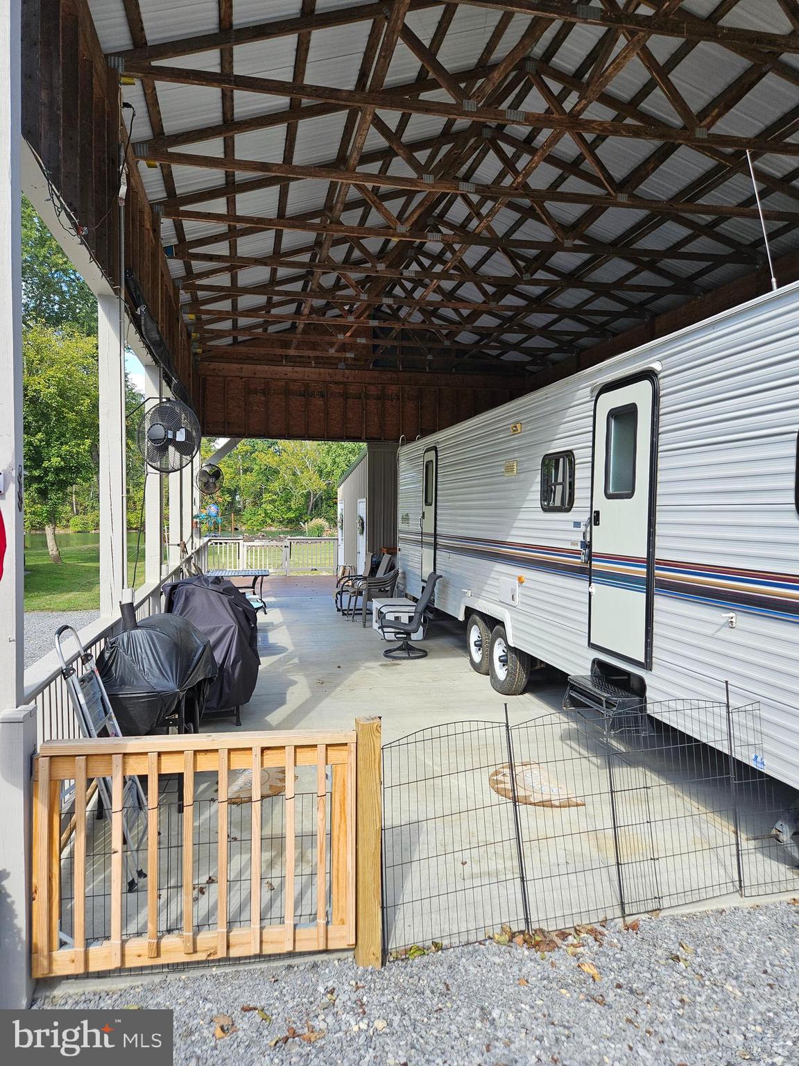 56 Boo Boo Boulevard Falling Waters, WV 25419 - Photo 13 of 48 a view of a house with backyard porch and sitting area