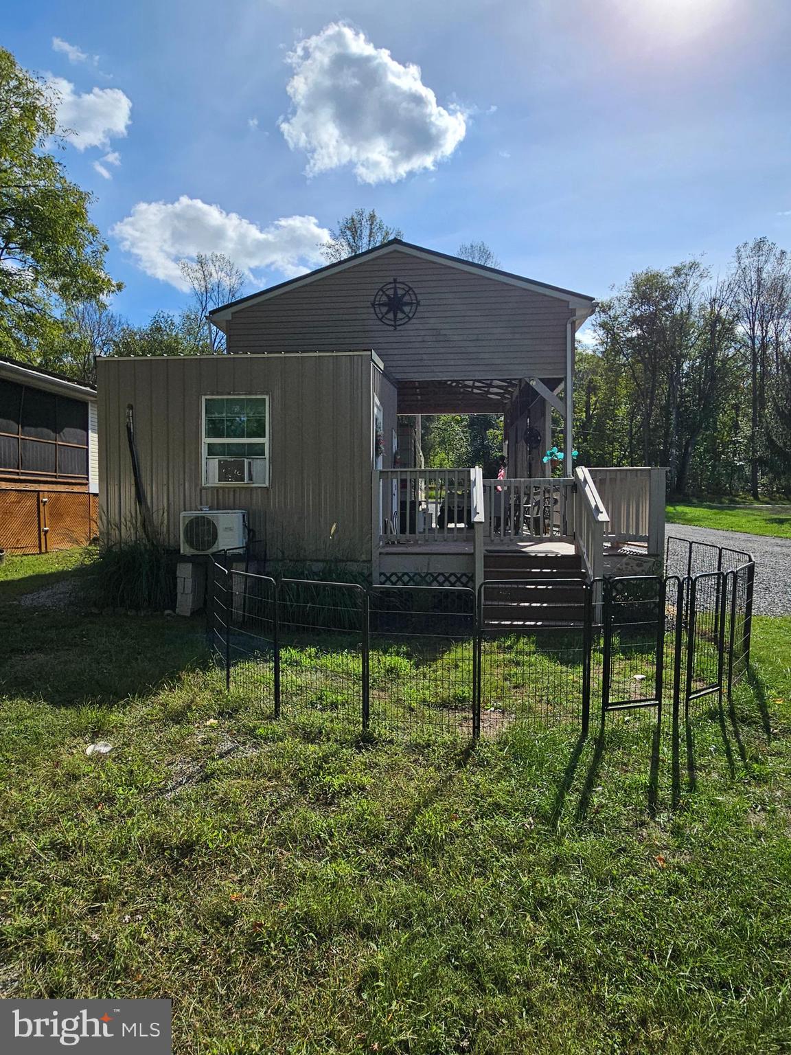 56 Boo Boo Boulevard Falling Waters, WV 25419 - Photo 15 of 48 a backyard of a house with table and chairs