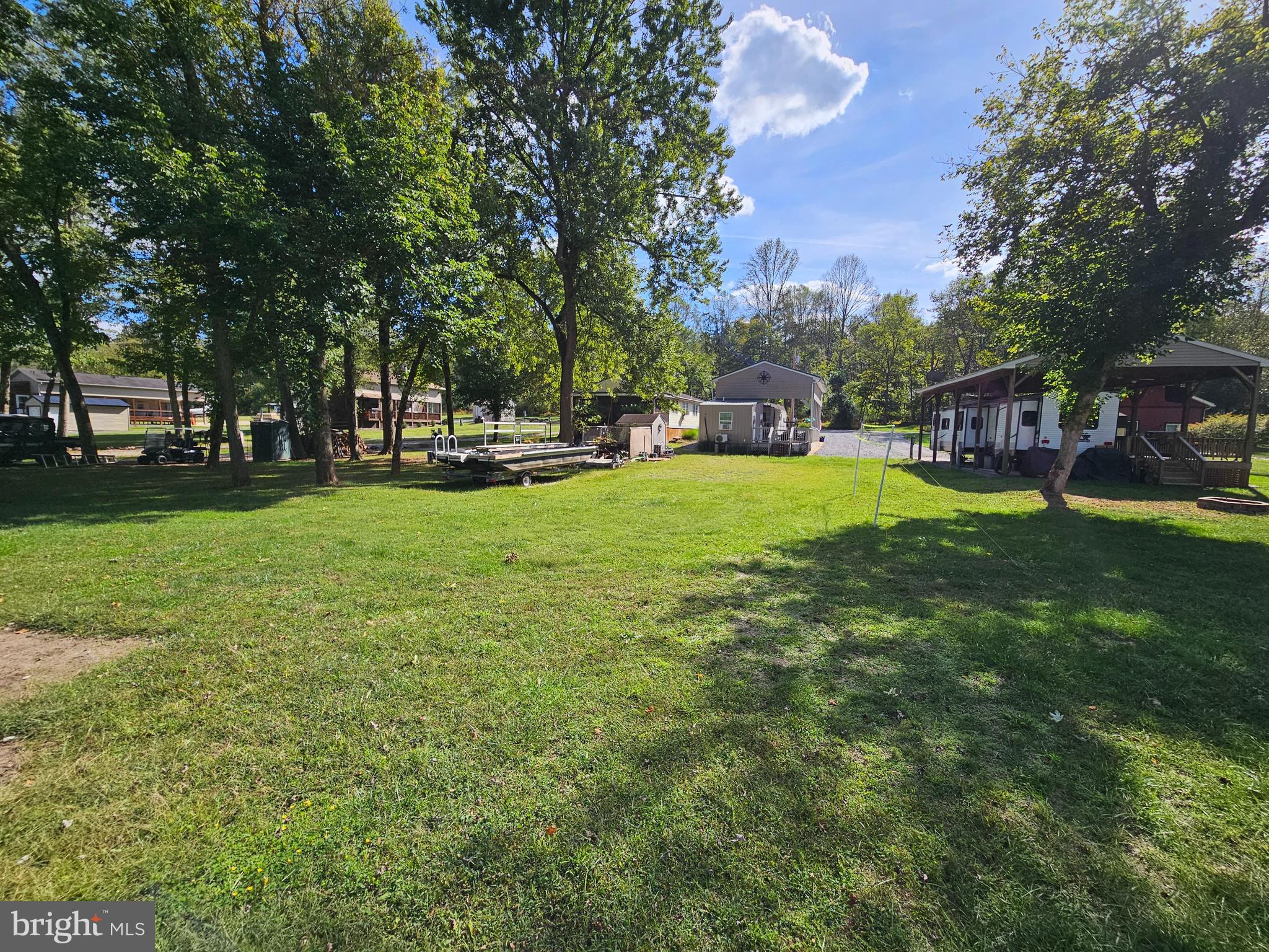 56 Boo Boo Boulevard Falling Waters, WV 25419 - Photo 18 of 48 a view of a park with large trees and a couple of chairs