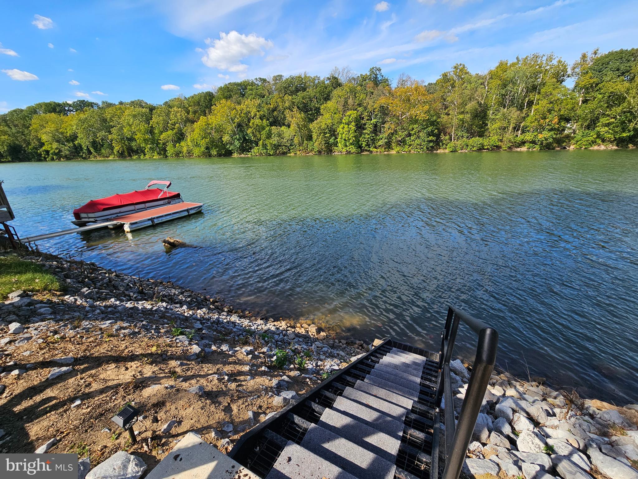 56 Boo Boo Boulevard Falling Waters, WV 25419 - Photo 2 of 48 a backyard of a house with lots of green space