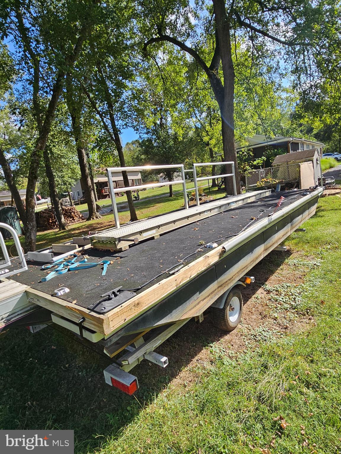 56 Boo Boo Boulevard Falling Waters, WV 25419 - Photo 23 of 48 a view of a backyard with a large tree and wooden fence