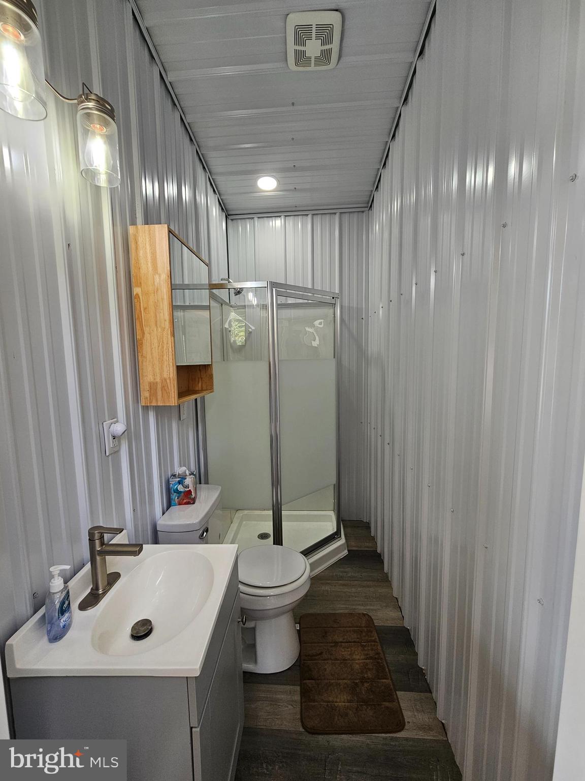 56 Boo Boo Boulevard Falling Waters, WV 25419 - Photo 27 of 48 a bathroom with a sink and mirror with toilet