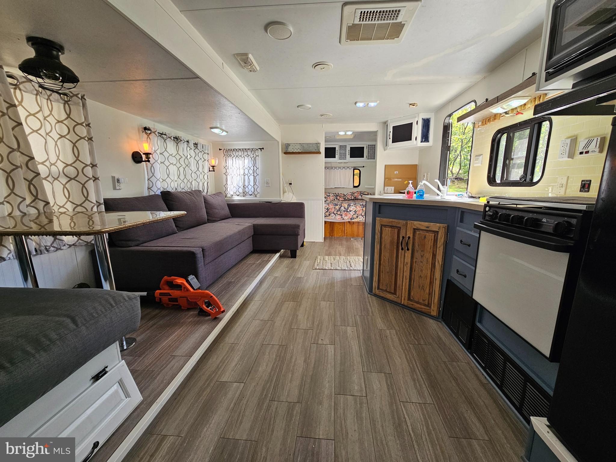 56 Boo Boo Boulevard Falling Waters, WV 25419 - Photo 28 of 48 a living room with furniture and a wooden floor