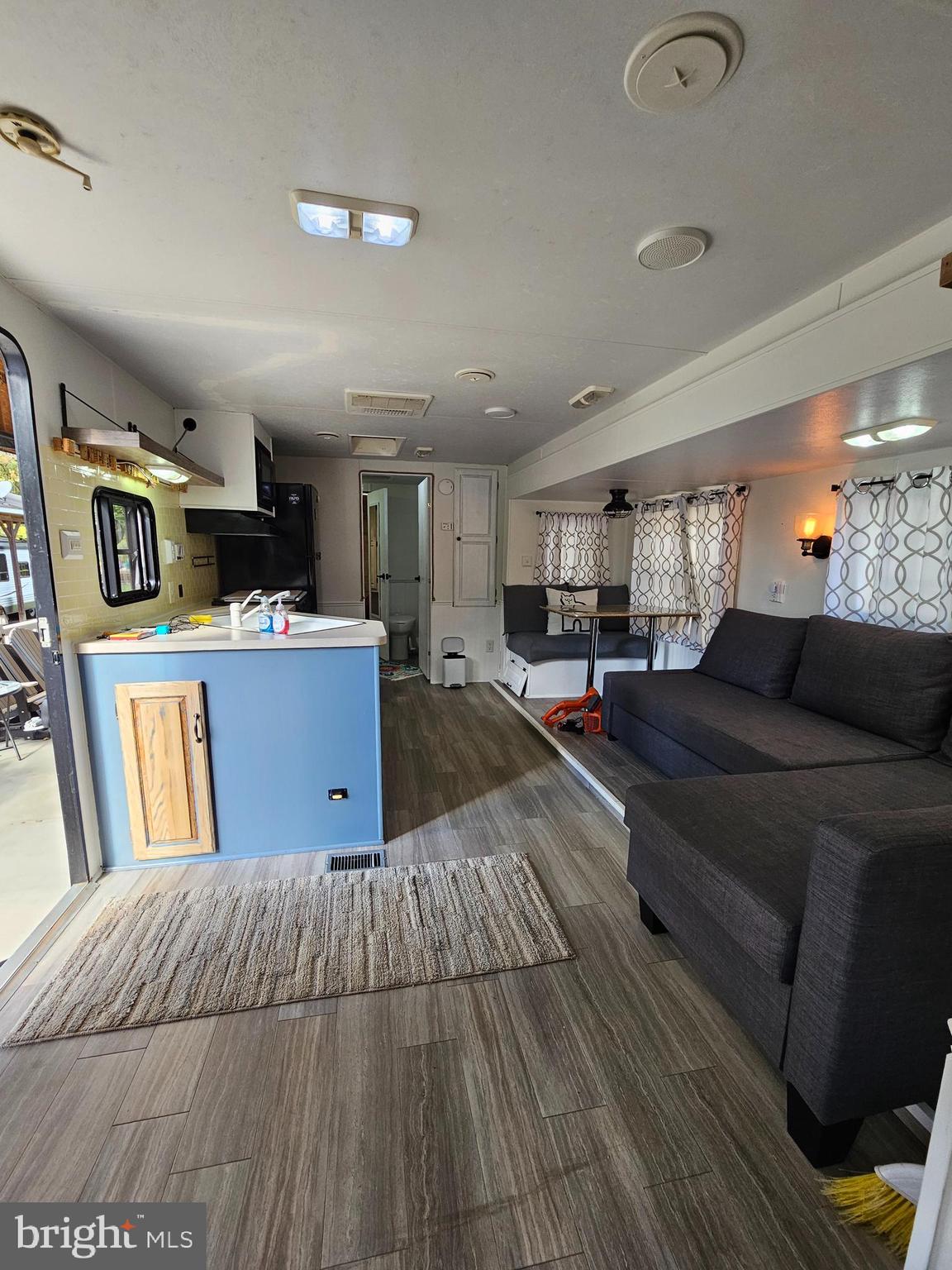 56 Boo Boo Boulevard Falling Waters, WV 25419 - Photo 30 of 48 a living room with lots of furniture and kitchen view