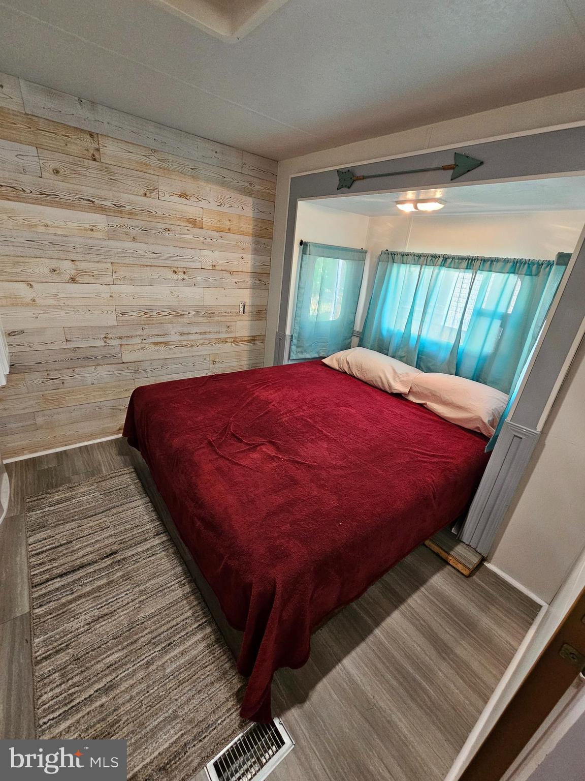 56 Boo Boo Boulevard Falling Waters, WV 25419 - Photo 33 of 48 a bed sitting in a bedroom next to a window