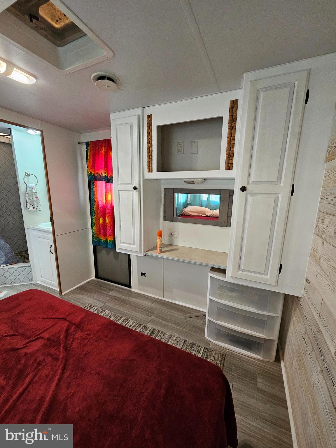 56 Boo Boo Boulevard Falling Waters, WV 25419 - Photo 34 of 48 a bedroom with a bed and a flat screen tv