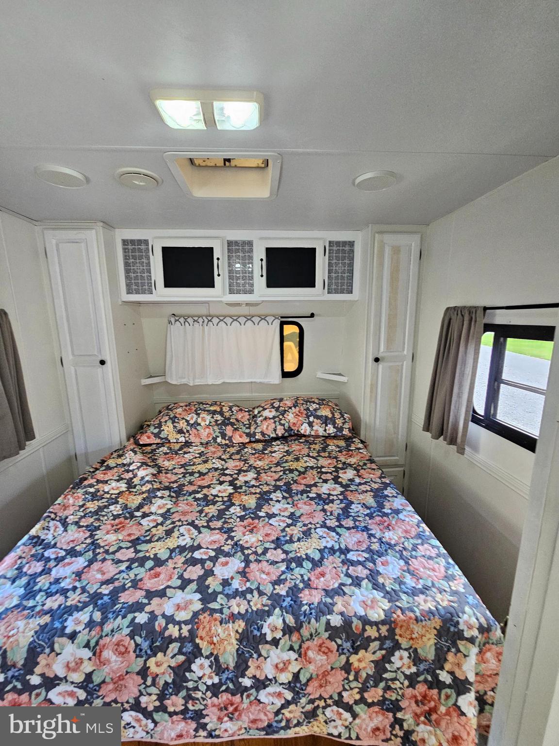 56 Boo Boo Boulevard Falling Waters, WV 25419 - Photo 37 of 48 a bedroom with a bed and a mirror