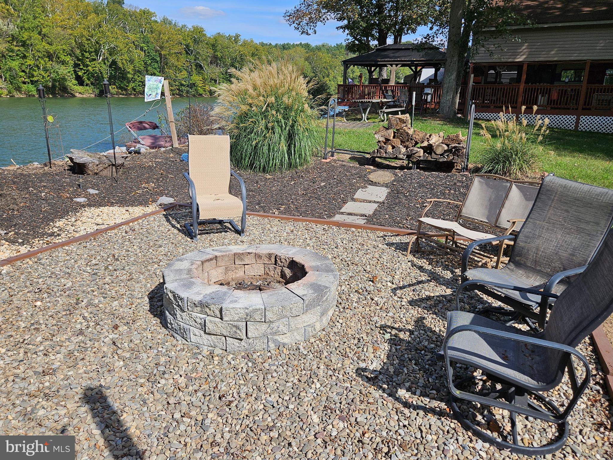 56 Boo Boo Boulevard Falling Waters, WV 25419 - Photo 5 of 48 a view of a backyard with sitting area and furniture