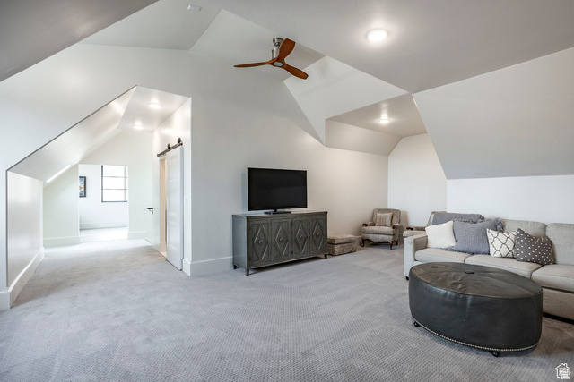 3247 South Mapleton Estates Drive Mapleton, UT 84664 - Photo 57 of 70 Sitting room with a barn door, a ceiling fan, and carpet flooring