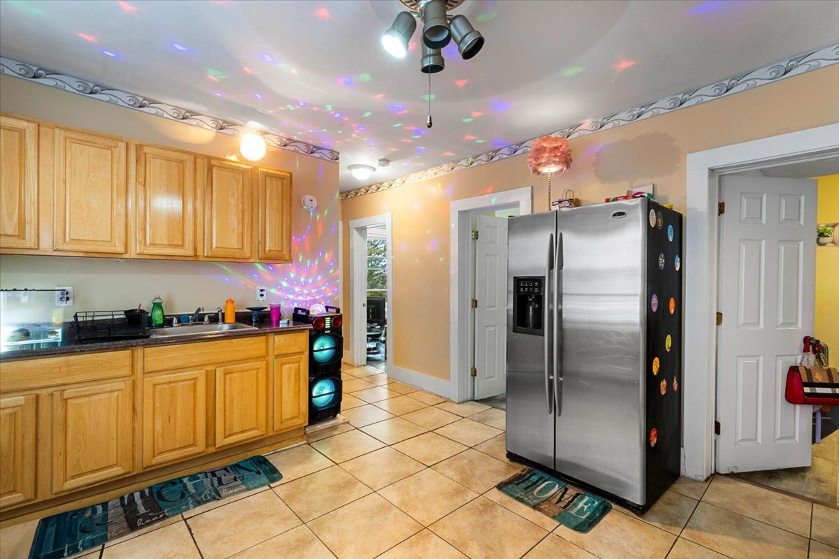 205 Smith Street Bridgeport, CT 06607 - Photo 14 of 28 a kitchen with stainless steel appliances granite countertop a refrigerator and a sink