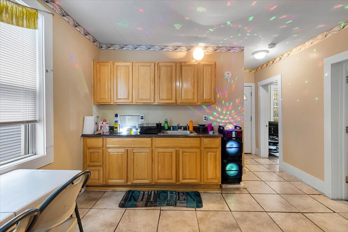 205 Smith Street Bridgeport, CT 06607 - Photo 15 of 28 a kitchen with stainless steel appliances granite countertop a refrigerator and a stove top oven