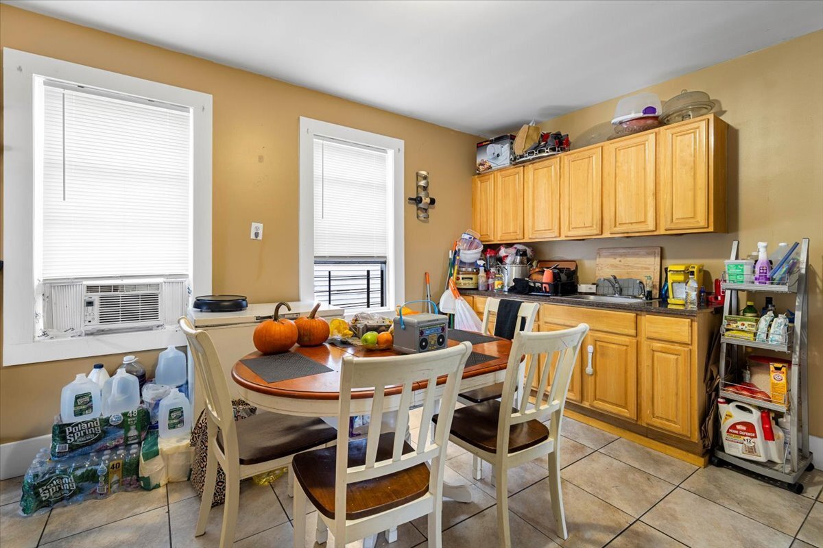 205 Smith Street Bridgeport, CT 06607 - Photo 22 of 28 a dining room with furniture and window