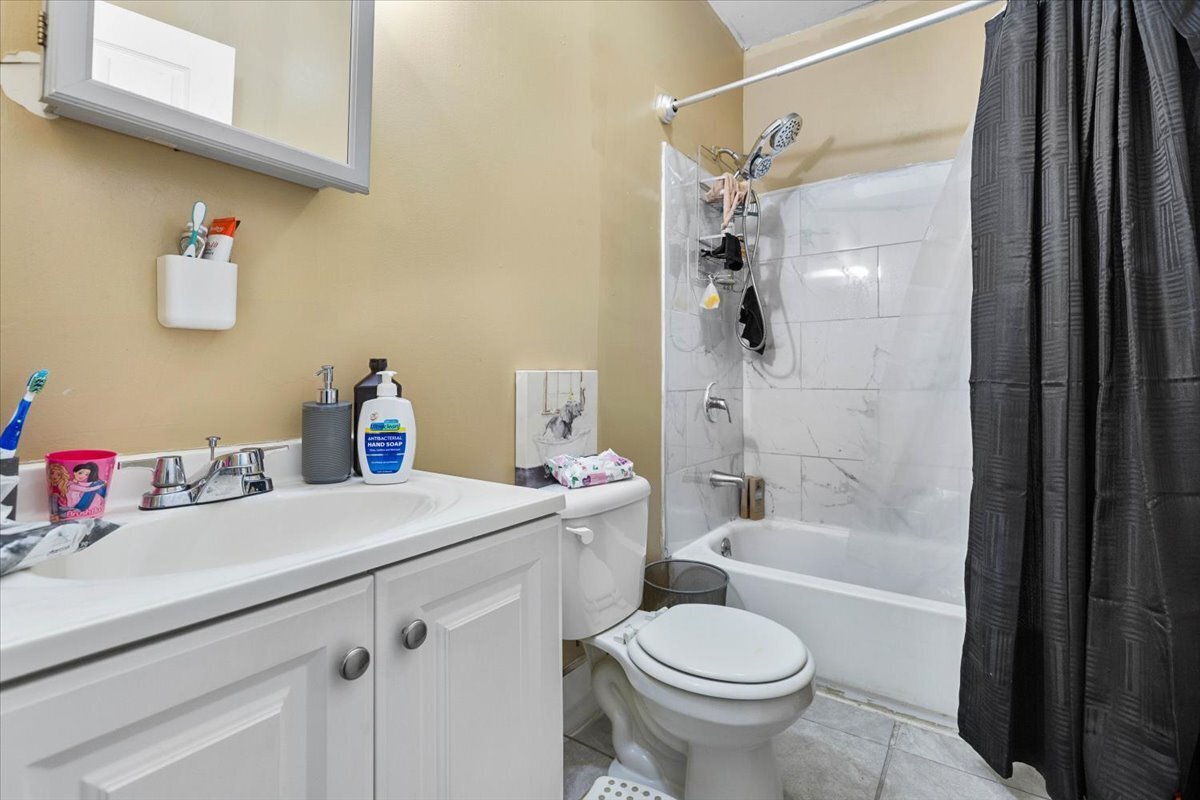 205 Smith Street Bridgeport, CT 06607 - Photo 24 of 28 a bathroom with a sink toilet and shower