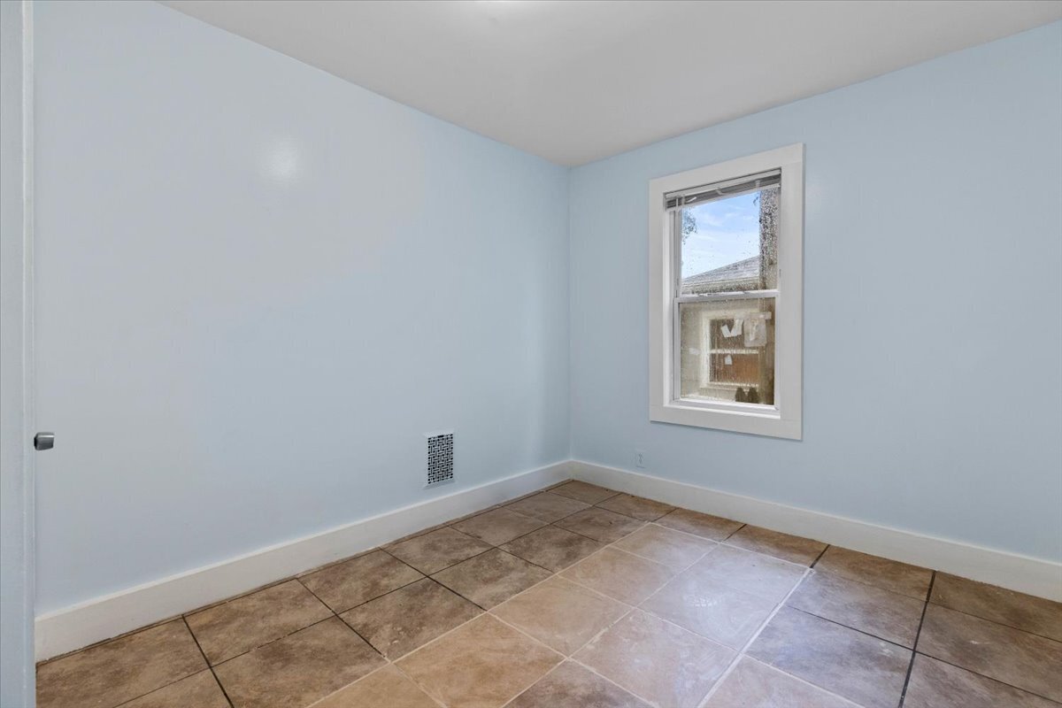 205 Smith Street Bridgeport, CT 06607 - Photo 5 of 28 a view of a room that has a window in it