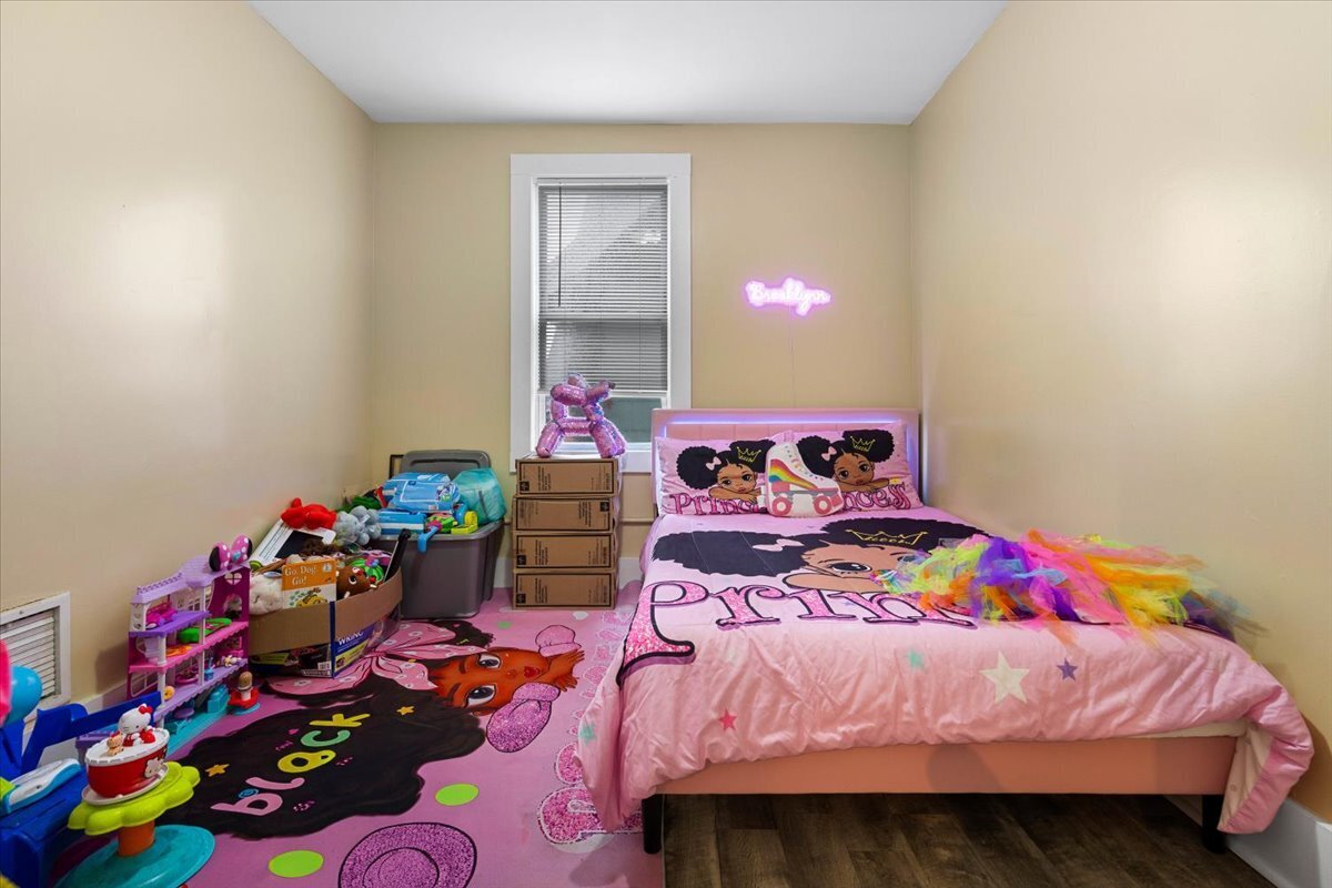 205 Smith Street Bridgeport, CT 06607 - Photo 10 of 28 a bedroom with bed and a window