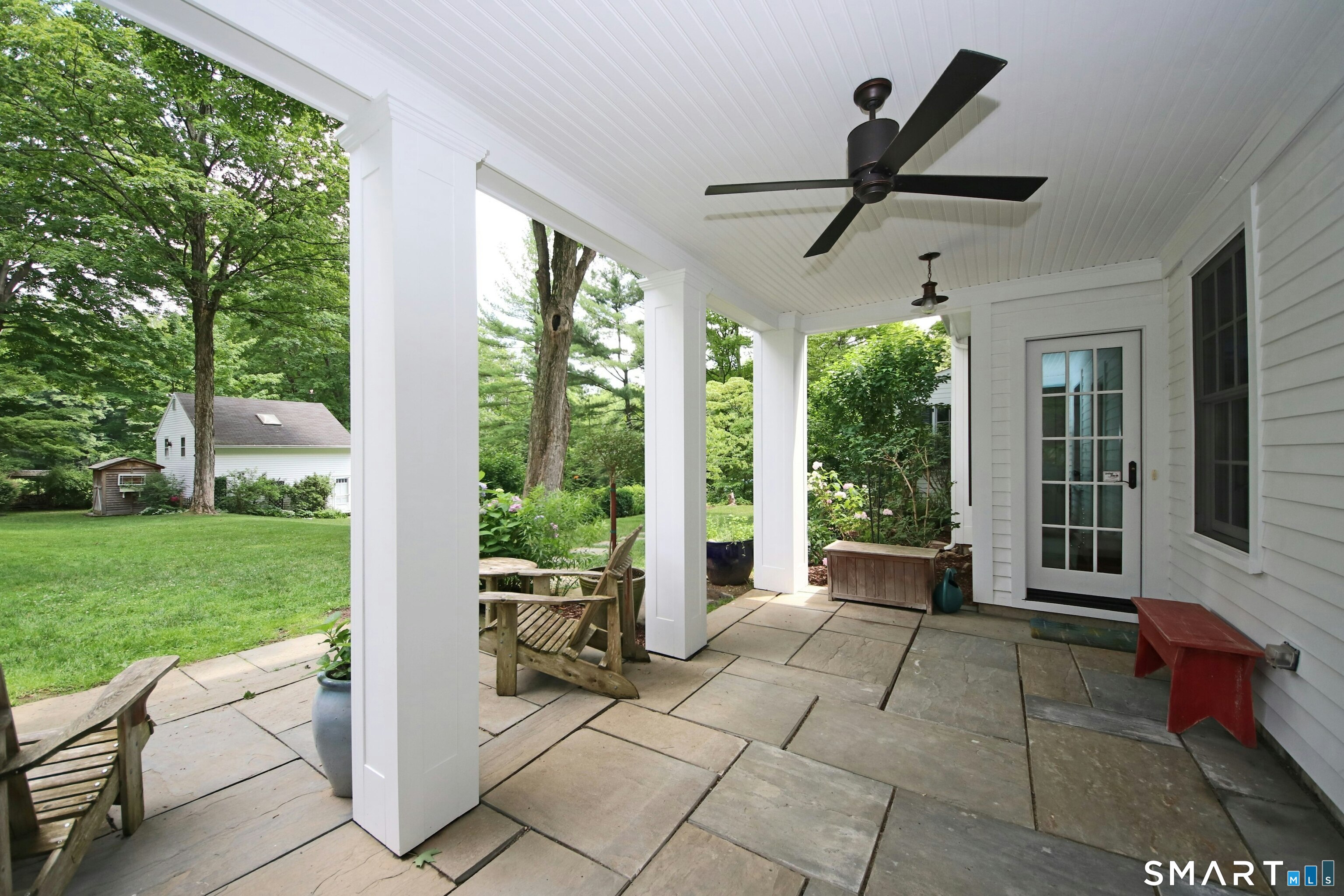 219 Bennetts Farm Road Ridgefield, CT 06877 - Photo 11 of 40 a living room with furniture and a floor to ceiling window