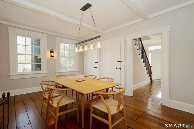 a dining room with furniture and window