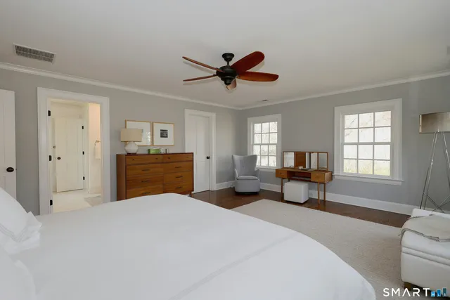 a bedroom with a bed and furniture