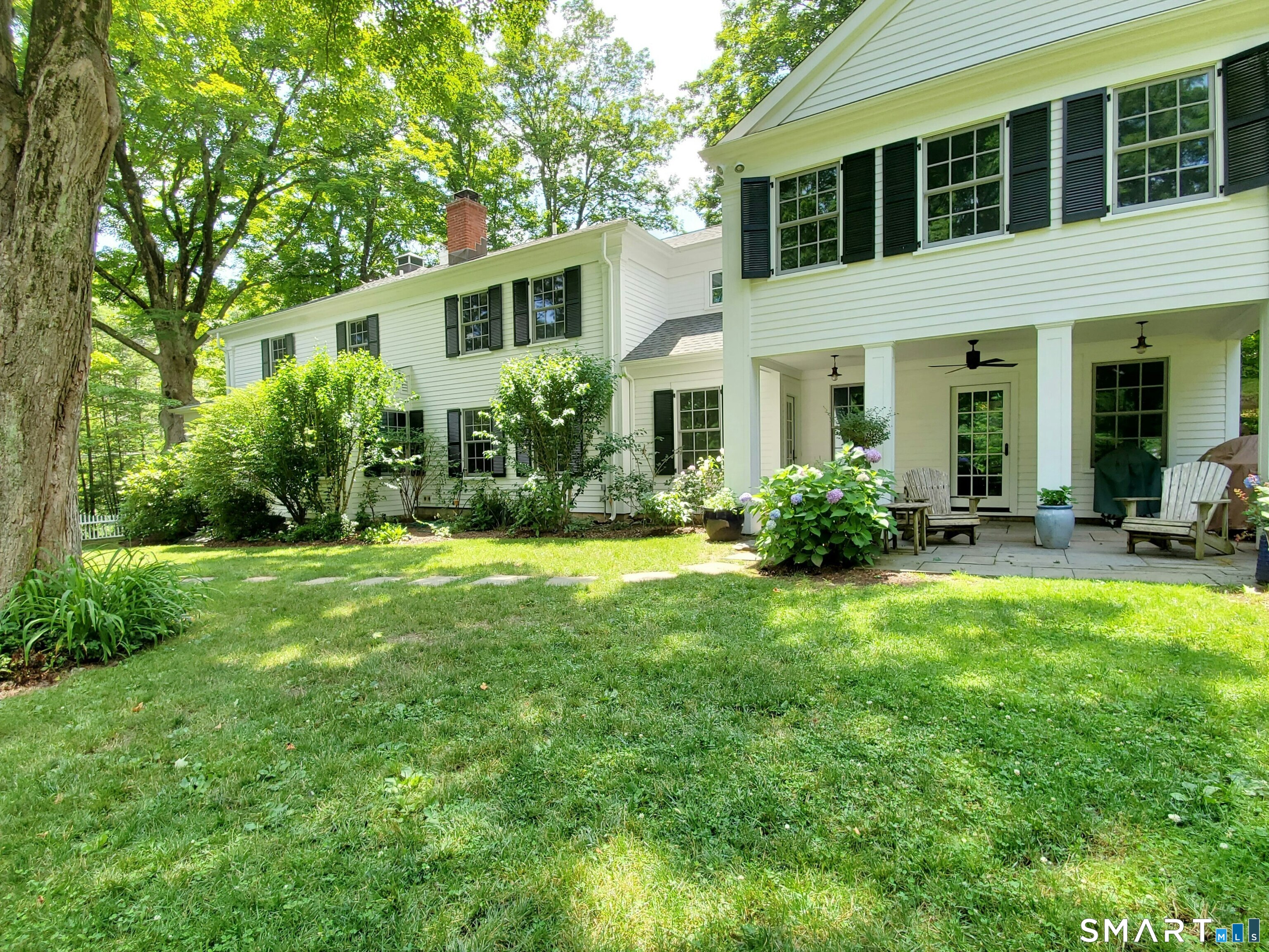 219 Bennetts Farm Road Ridgefield, CT 06877 - Photo 6 of 40 a house view with a garden space
