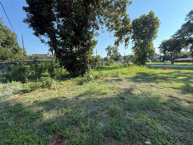 a view of outdoor space with trees all around