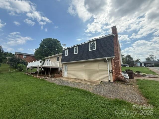2205 Olde Well Road Hudson, NC 28638 - Photo 19 of 23 a view of a house with a backyard