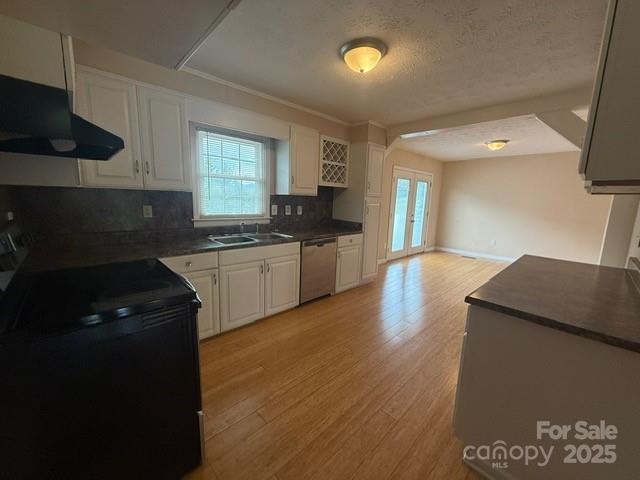 2205 Olde Well Road Hudson, NC 28638 - Photo 5 of 23 a kitchen with granite countertop a sink a stove top oven and cabinetry