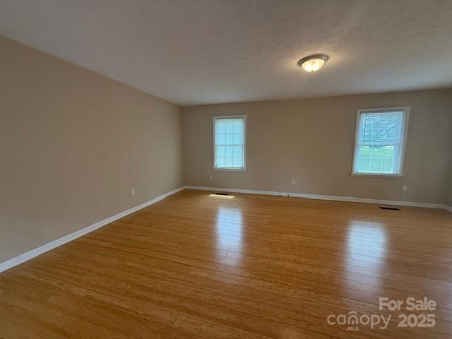 2205 Olde Well Road Hudson, NC 28638 - Photo 7 of 23 a view of empty room with wooden floor and fan