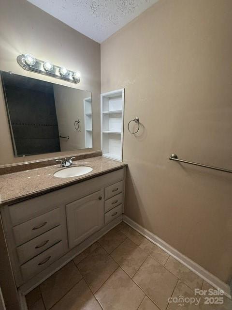 2205 Olde Well Road Hudson, NC 28638 - Photo 10 of 23 a bathroom with a double vanity sink and a mirror