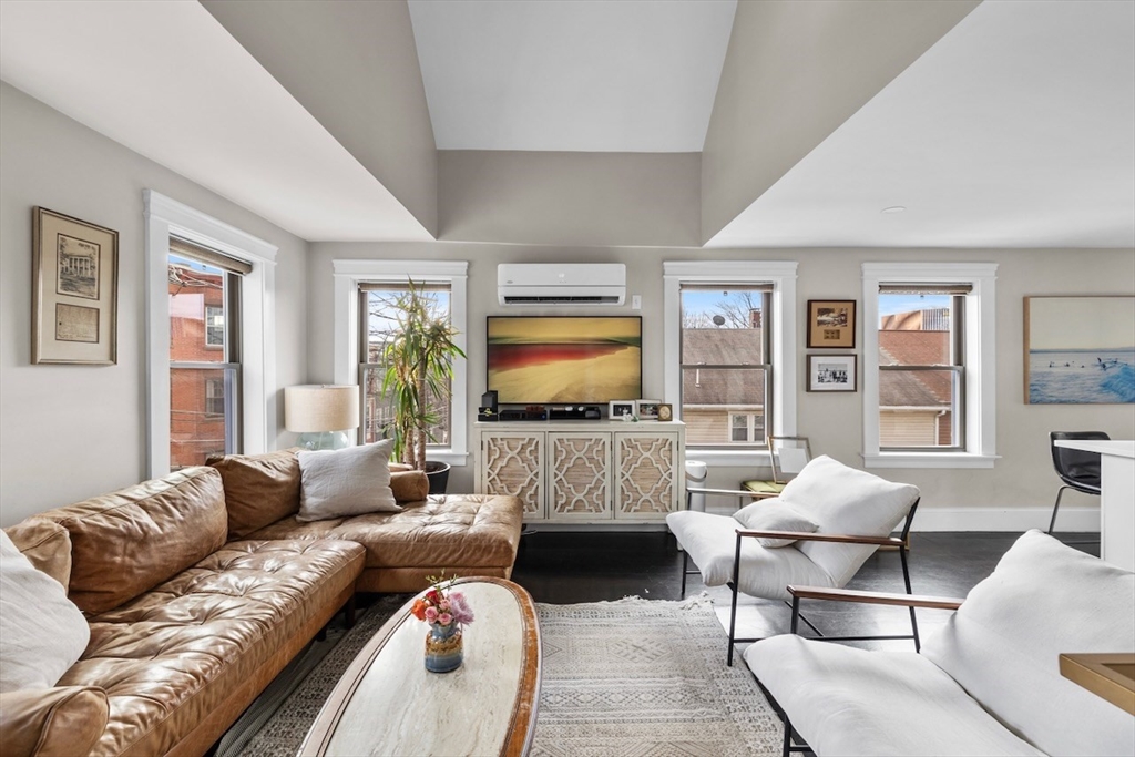 38 Mead Street, Unit 2 Boston, MA 02129 - Photo 1 of 14 a living room with furniture and a flat screen tv
