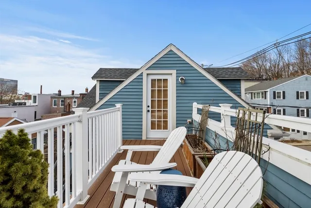 a view of a house with wooden deck