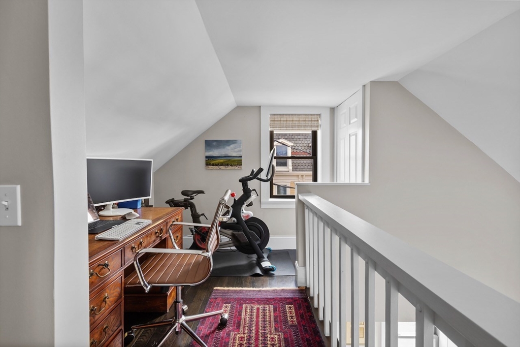 38 Mead Street, Unit 2 Boston, MA 02129 - Photo 6 of 14 a view of a workspace with wooden floor and white cabinet