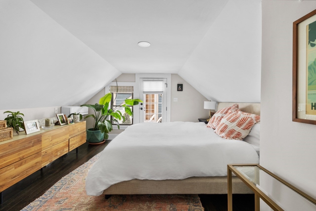 38 Mead Street, Unit 2 Boston, MA 02129 - Photo 7 of 14 a bedroom with a bed table and window