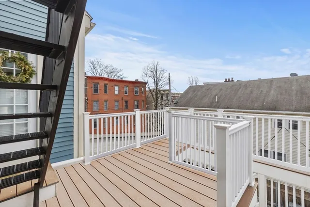 a view of balcony with wooden floor