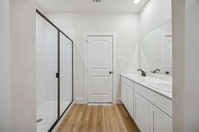 a bathroom with a sink a mirror and a bathtub