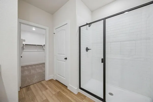 a bathroom with a double vanity sink and mirror