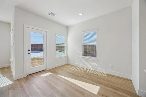 a kitchen with stainless steel appliances a sink a stove a microwave and cabinets