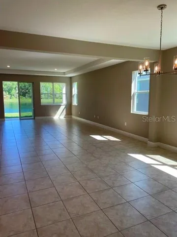 a view of a room with window and stairs